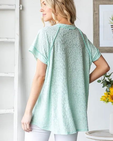 Heimish Full Size Exposed Seam V-Neck Short Sleeve Leopard Top Plus Size