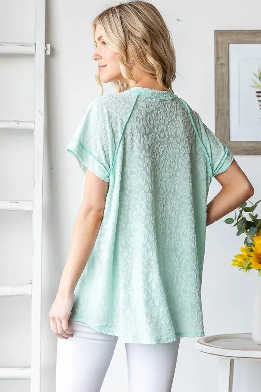 Heimish Full Size Exposed Seam V-Neck Short Sleeve Leopard Top Plus Size