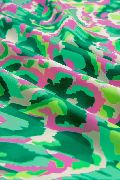 Abstract Print Ruffled Trim Tie Neck Top