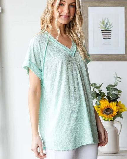 Heimish Full Size Exposed Seam V-Neck Short Sleeve Leopard Top Plus Size