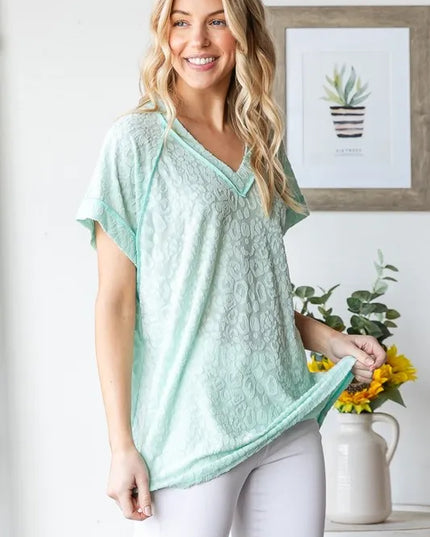 Heimish Full Size Exposed Seam V-Neck Short Sleeve Leopard Top Plus Size