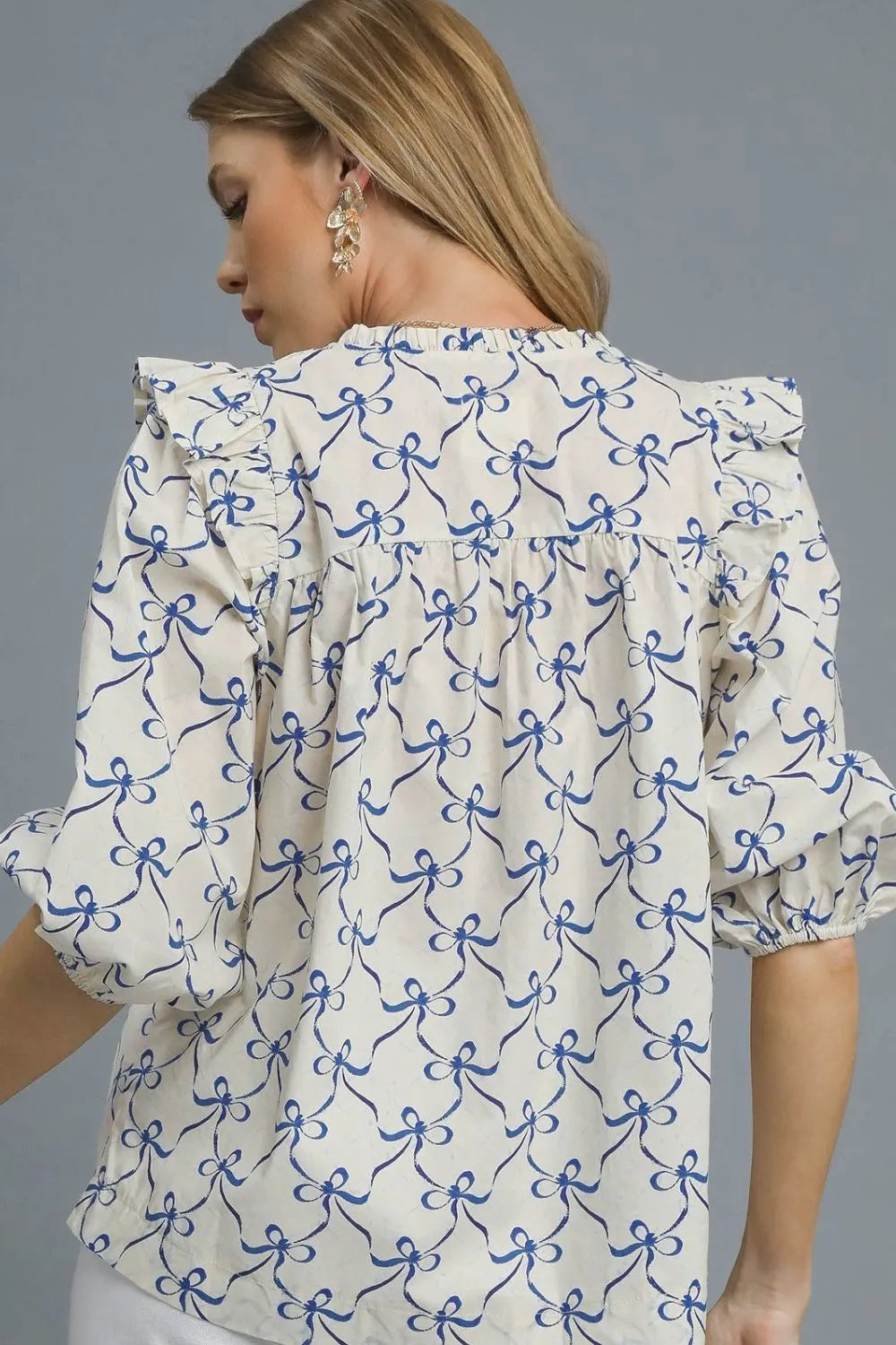 Umgee Ruffled Bow Print Notched Blouse