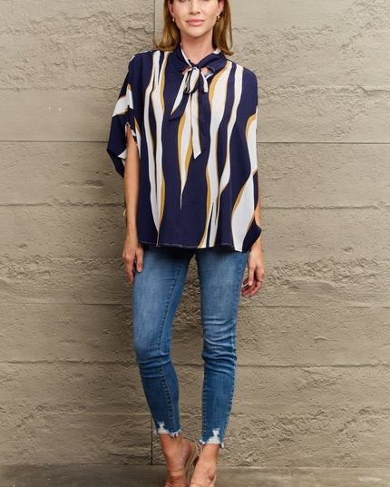 Perfee Tie Neck Printed Slit Sleeve Blouse